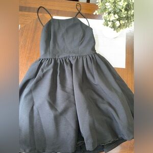Woman’s size medium black backless lulu mini dress